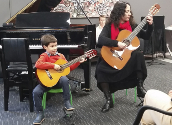 Suzuki Guitar Teacher Nazli Bodaghi performing with her student Dara at the Term 2 2018 Student Concert